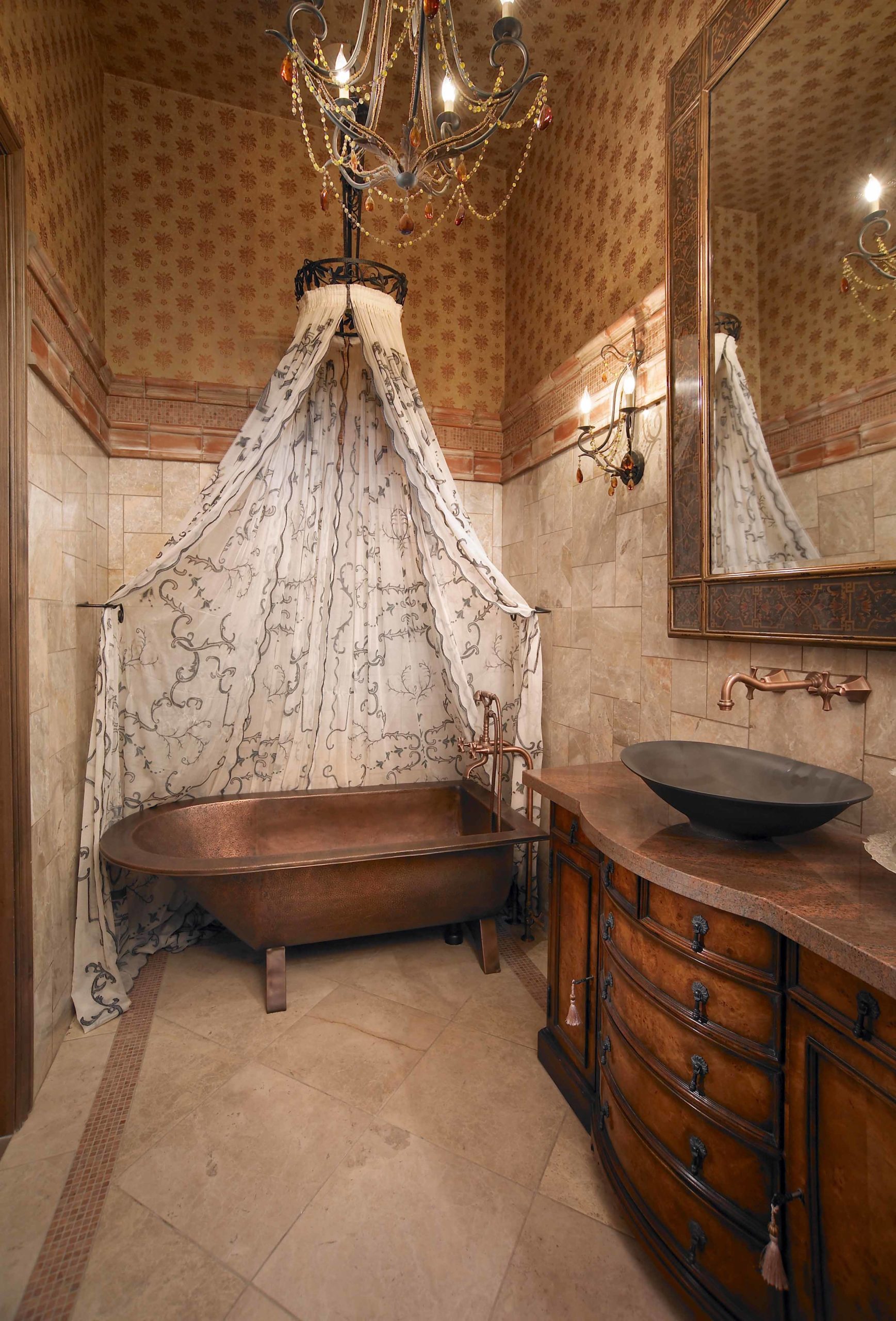 Bathroom with tiled floors and walls and patterned wallpaper and a circular shower curtain hanging above tub
