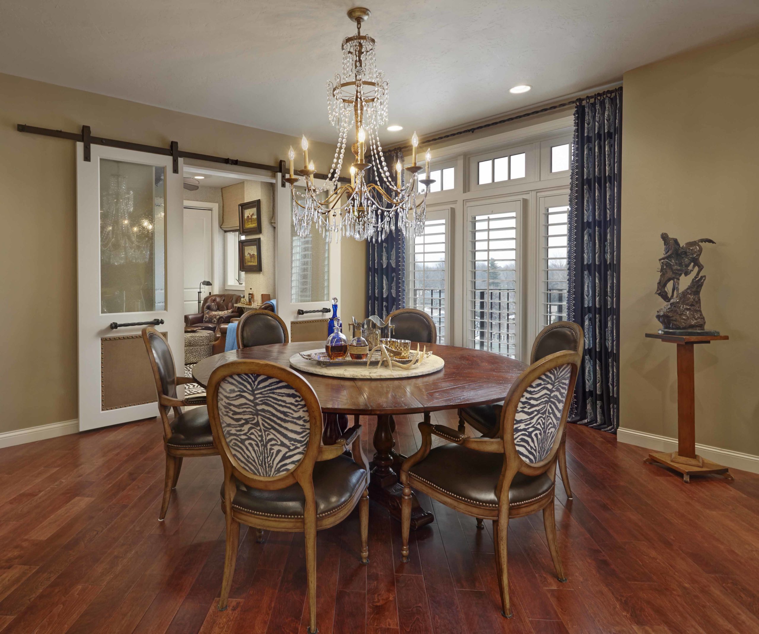 Dining room with round table and zebra print chairs